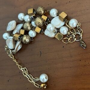 4 strand bracelet with beads, shells, pearls.